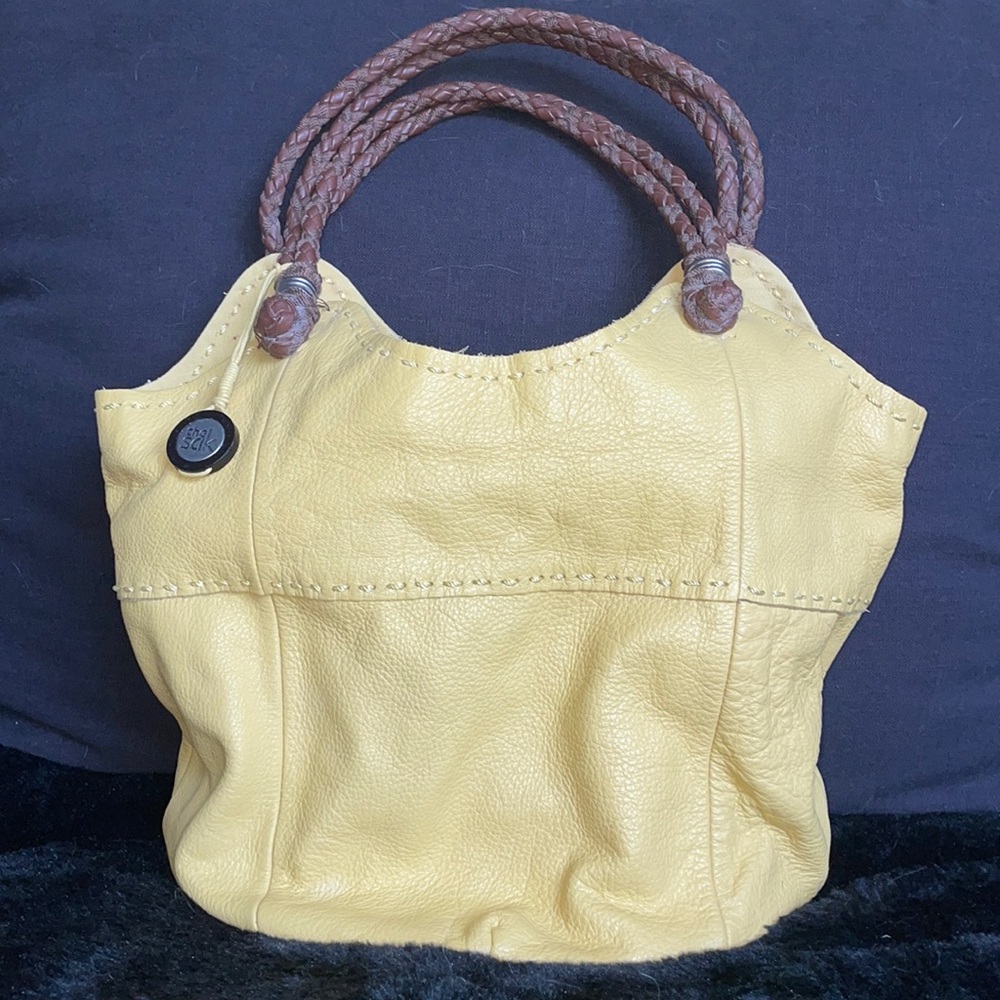 The Sak yellow bucket tote bag